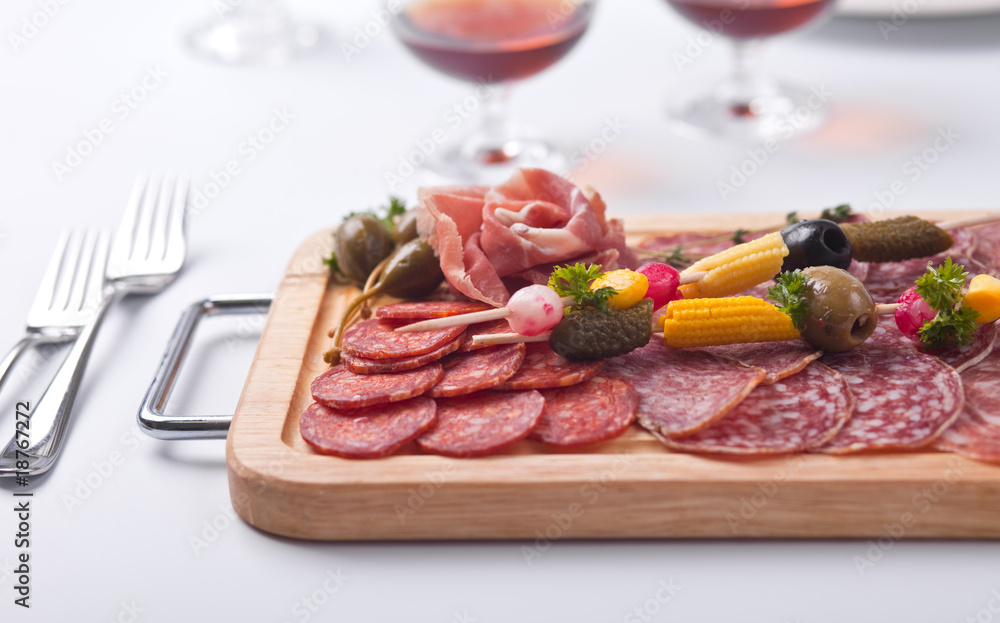 Board at restaurant with meat and sausage cutting