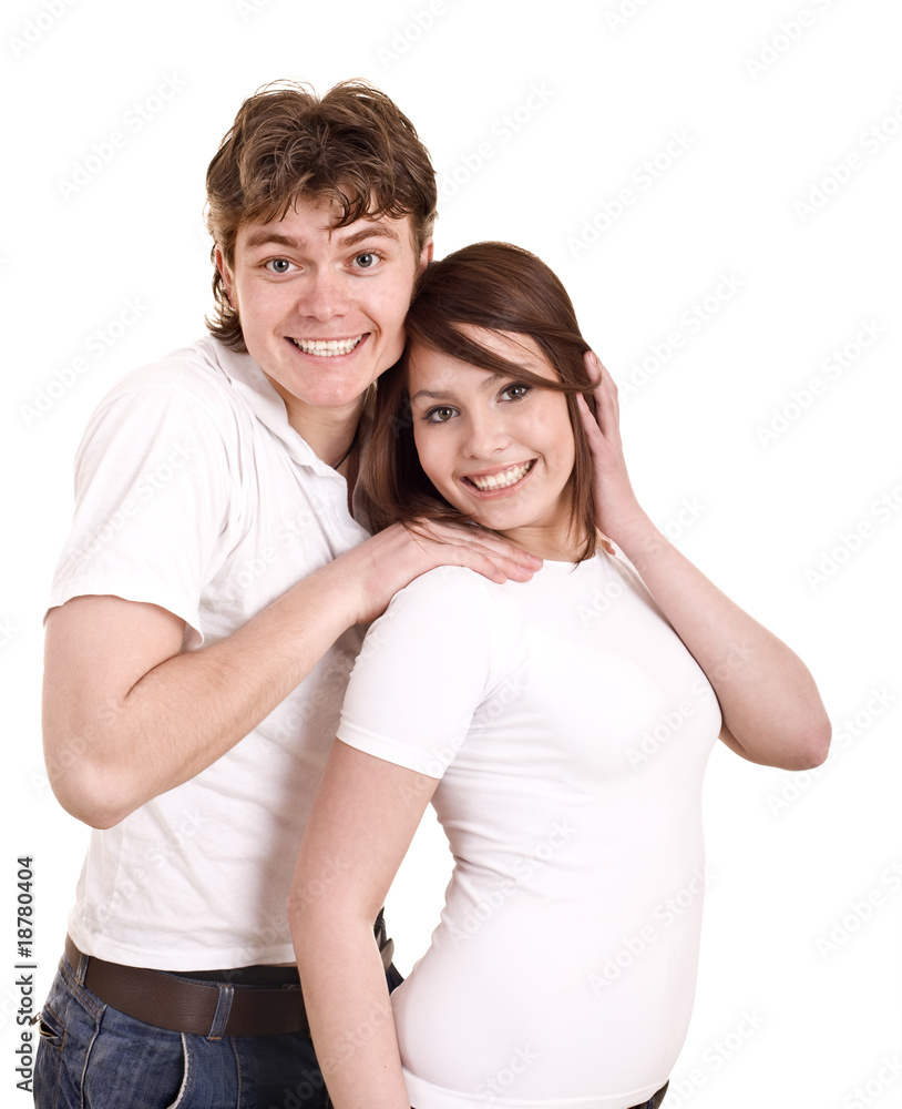 Couple in blue jeans and white shirt embrace. Isolated. Couple in blue jeans and white shirt embrace. Isolated.