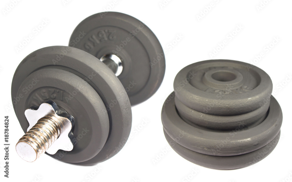 Dumbbell and weights isolated on white Dumbbell and weights isolated on white