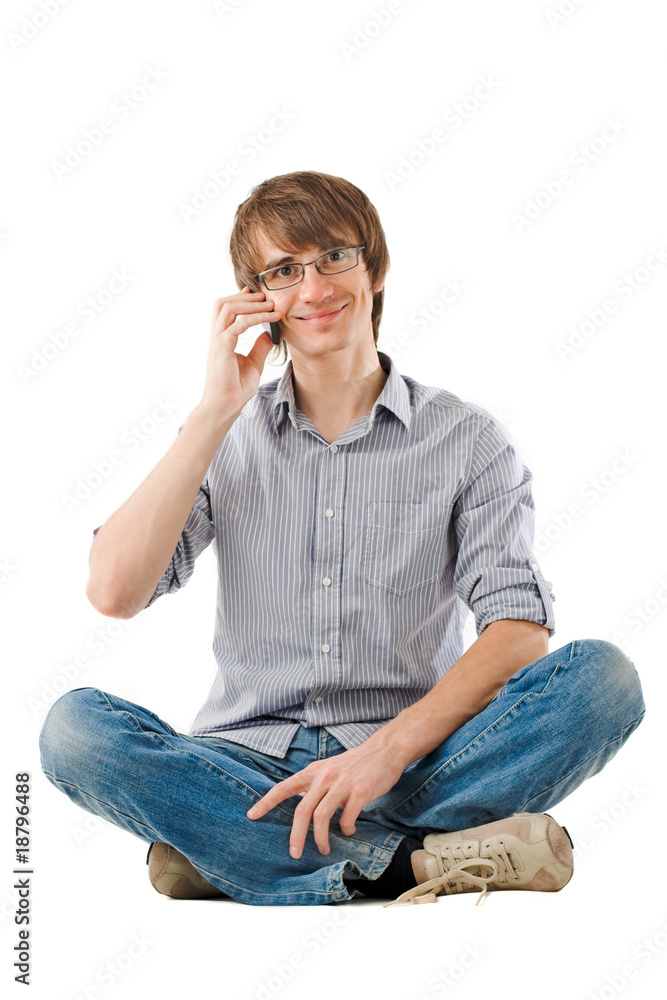Handsome young man talking by mobile phone Handsome young man talking by mobile phone