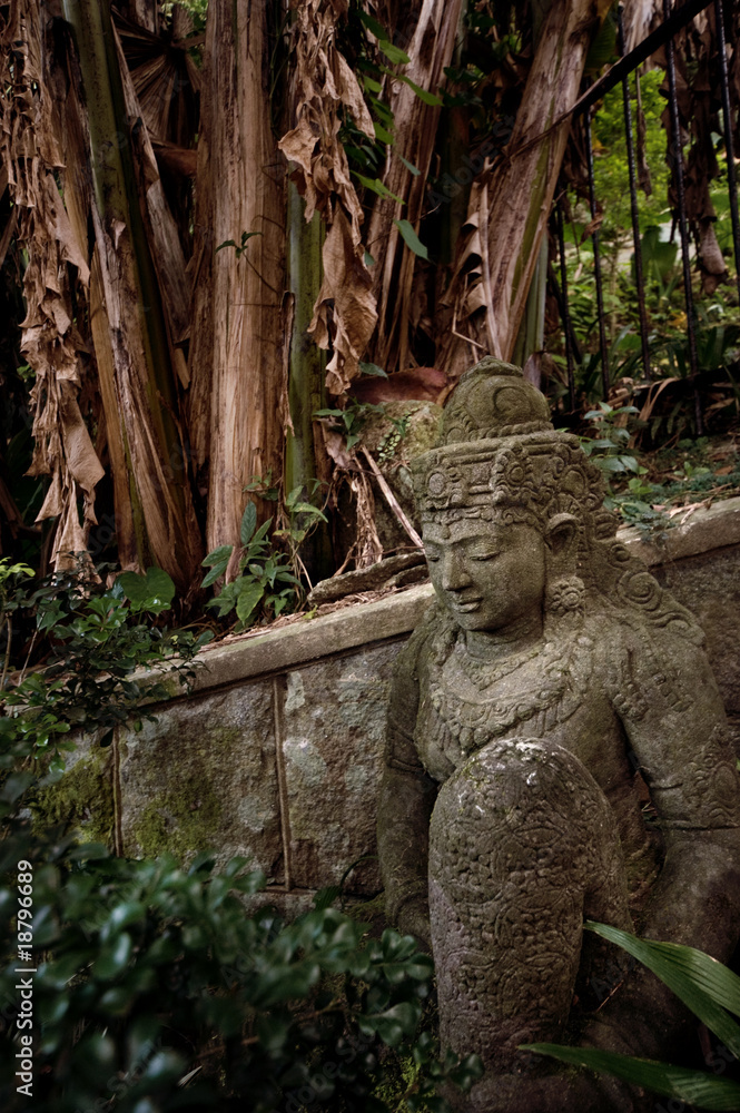 Ancient statue in the forest