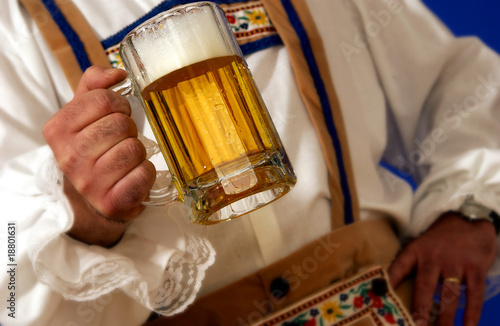Man holding mug of beer