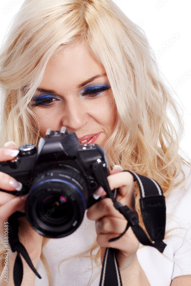 Beautiful smiling woman with digital camera. Isolated on white b Beautiful smiling woman with digital camera. Isolated on white b
