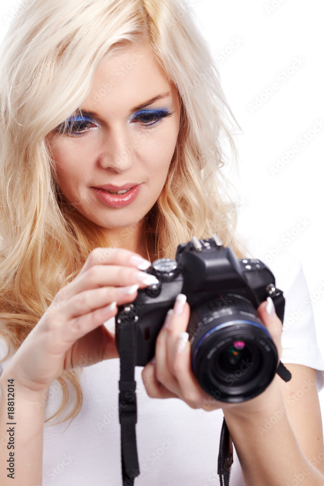 Beautiful smiling woman with digital camera. Isolated on white b Beautiful smiling woman with digital camera. Isolated on white b