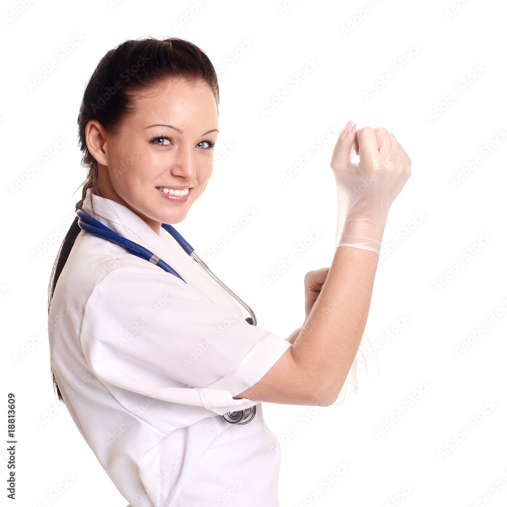 Female doctor putting on surgical gloves. Female doctor putting on surgical gloves.