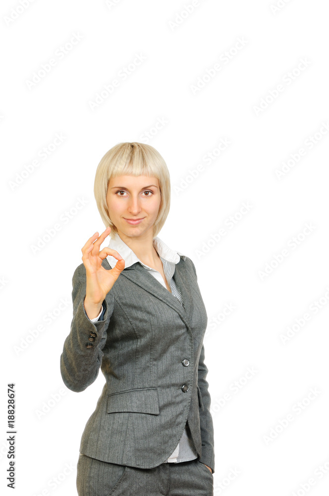 Businesswoman smiling doing the ok sign isolated on white Businesswoman smiling doing the ok sign isolated on white