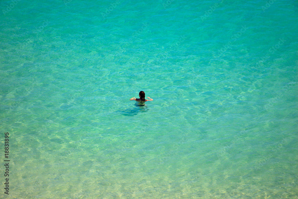 Woman Swimming In Clear Water in Byron Bay