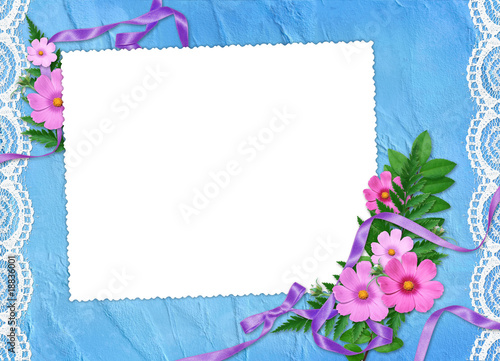 White frame with flowers  plants and ribbon on the blue backgrou