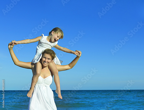 woman and girl on the beach