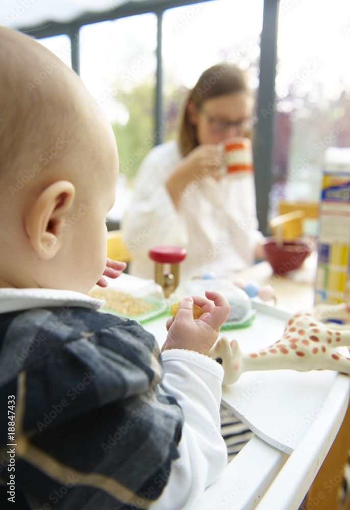 Baby and Mom at Breakfast Table Baby and Mom at Breakfast Table