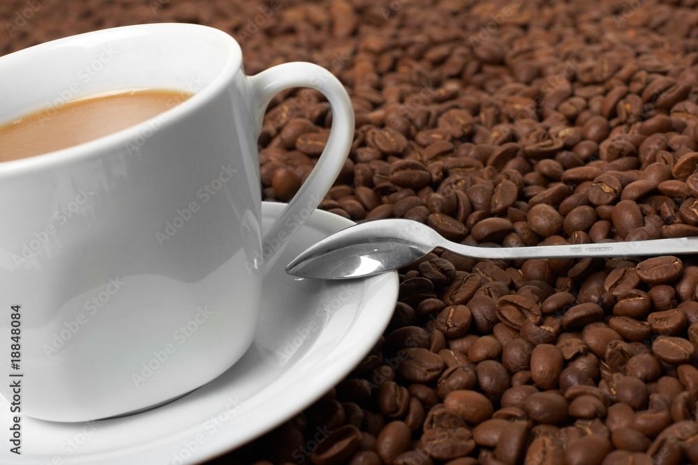 Cup with coffee, costing on coffee grain