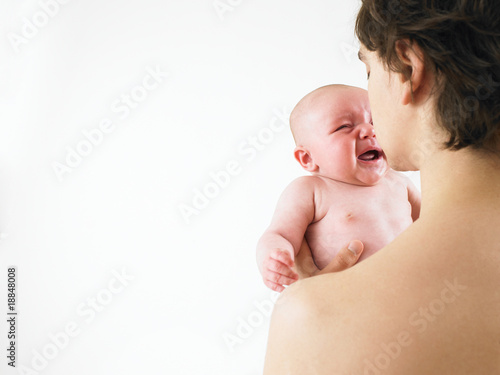 Parent Holding Crying Baby