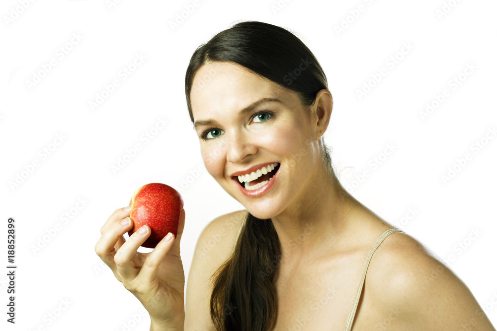 Young happy beautiful woman eating an apple Young happy beautiful woman eating an apple