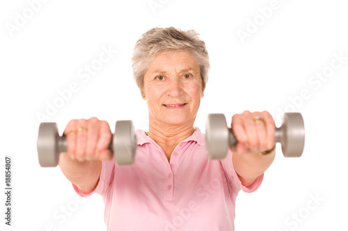 Mature lady lifting weights