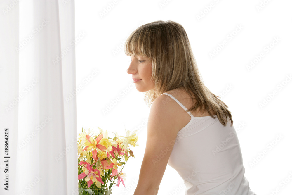Woman waiting for somebody looking through the window