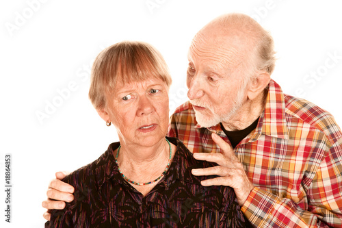 Senior man sharing information with concerned wife