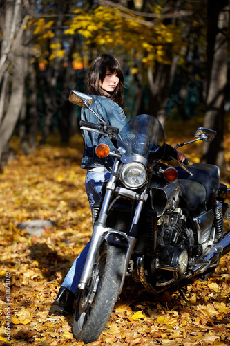 The brunette girl about a motorcycle