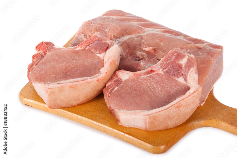 Fresh pork meat on wooden board