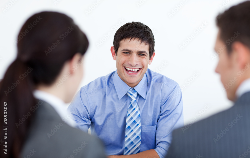 Smiling business people discussing at a job interview Smiling business people discussing at a job interview