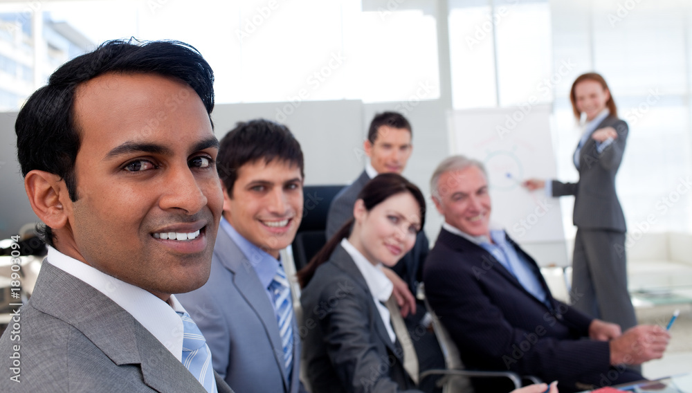 Confident manager discussing a new strategy her team Confident manager discussing a new strategy her team