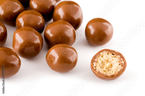 Chocolate balls and a half with crisp filling isolated on white