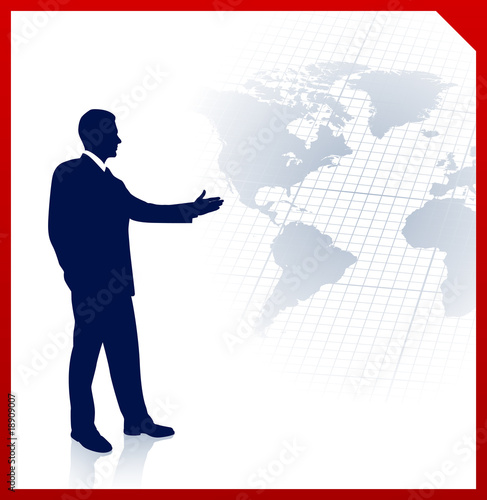 Young businessman pointing at world map