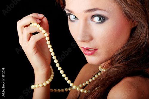 Woman with a pearl necklace