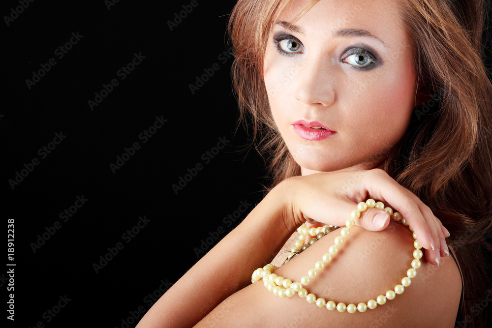 Woman with a pearl necklace