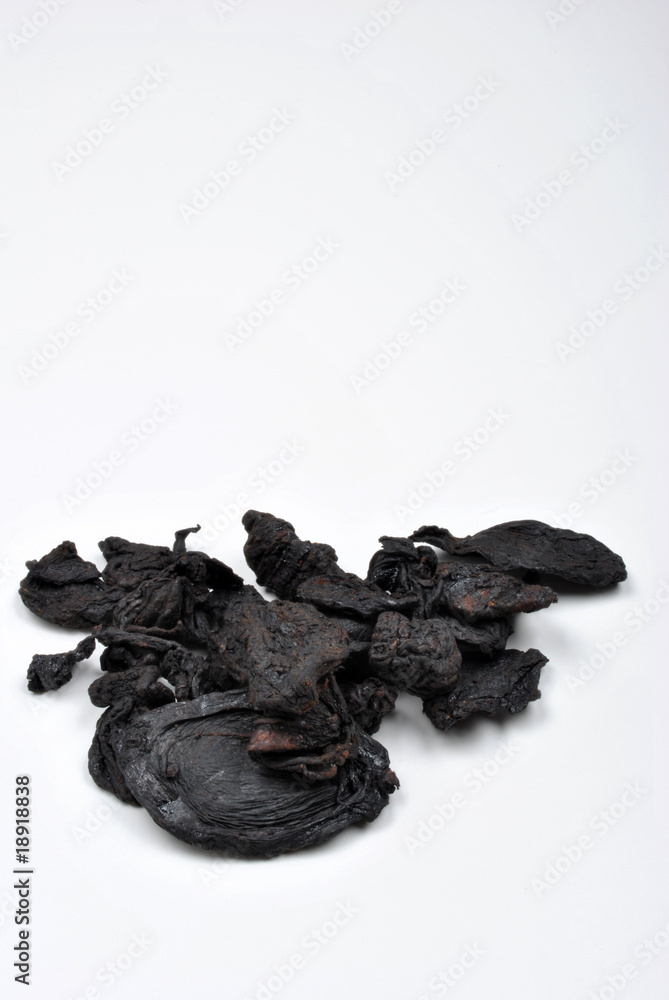 organic black tamarind on a white background organic black tamarind on a white background