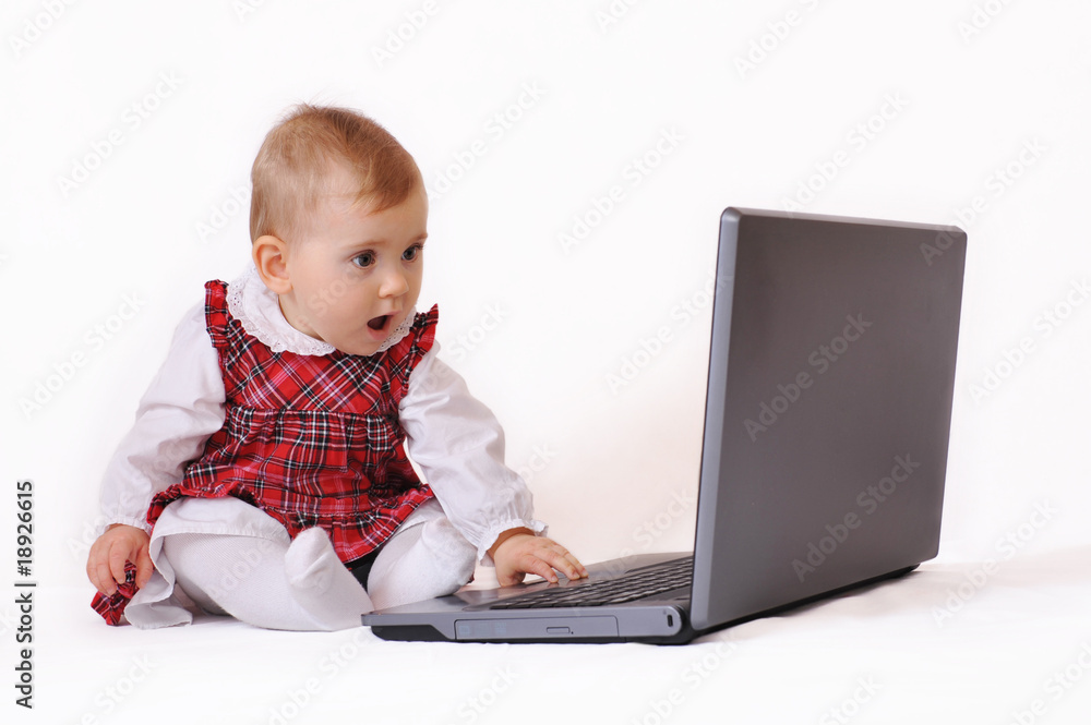 Little babygirl and computer Little babygirl and computer