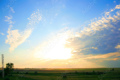 Summer landscape of fabulous sky and sunrise.
