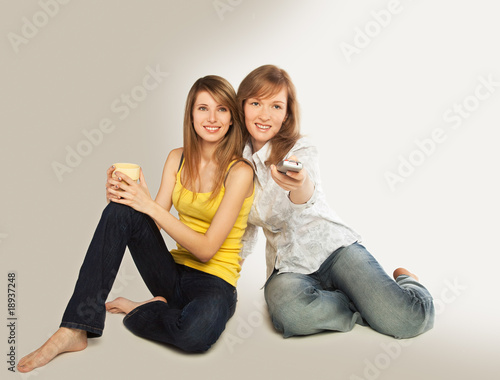 Young women watch TV