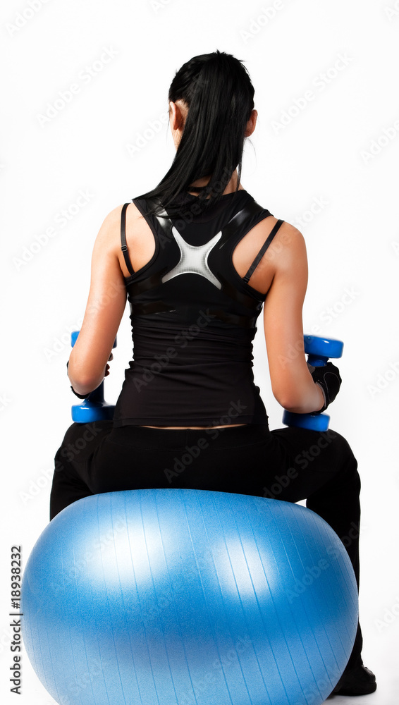 Brunette athlete holding weights Brunette athlete holding weights