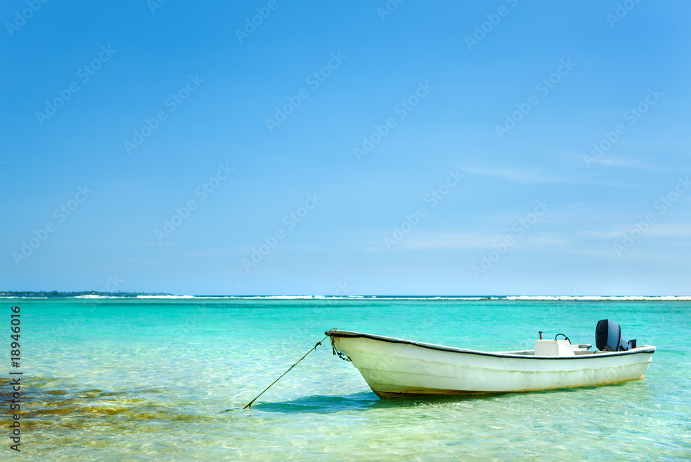 Sailboat anchored in Caribbean sea on a summer day Sailboat anchored in Caribbean sea on a summer day