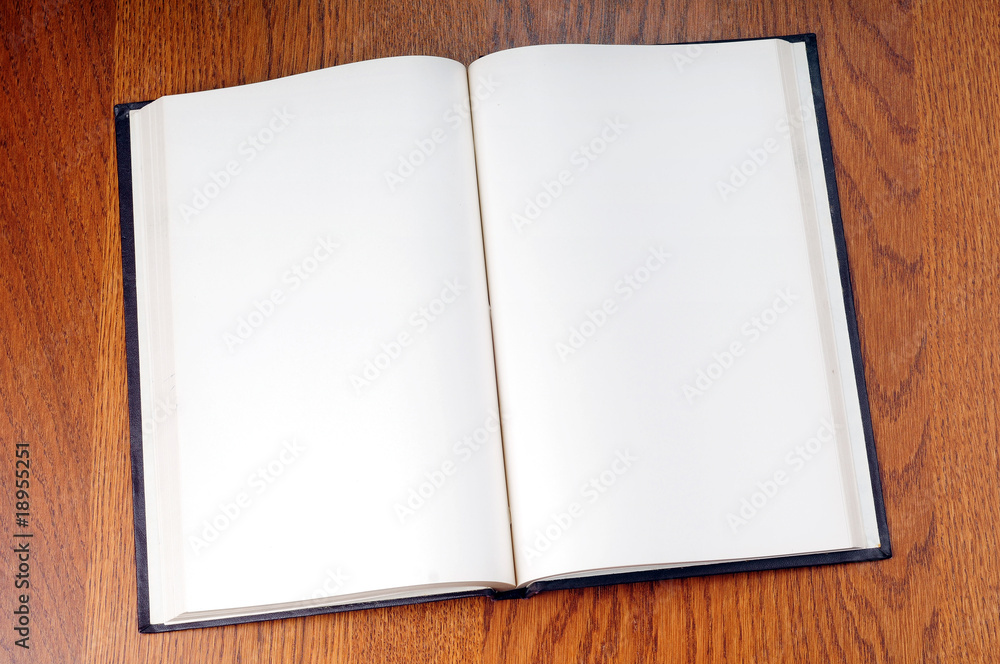 Blank open book with white page on wood background Blank open book with white page on wood background
