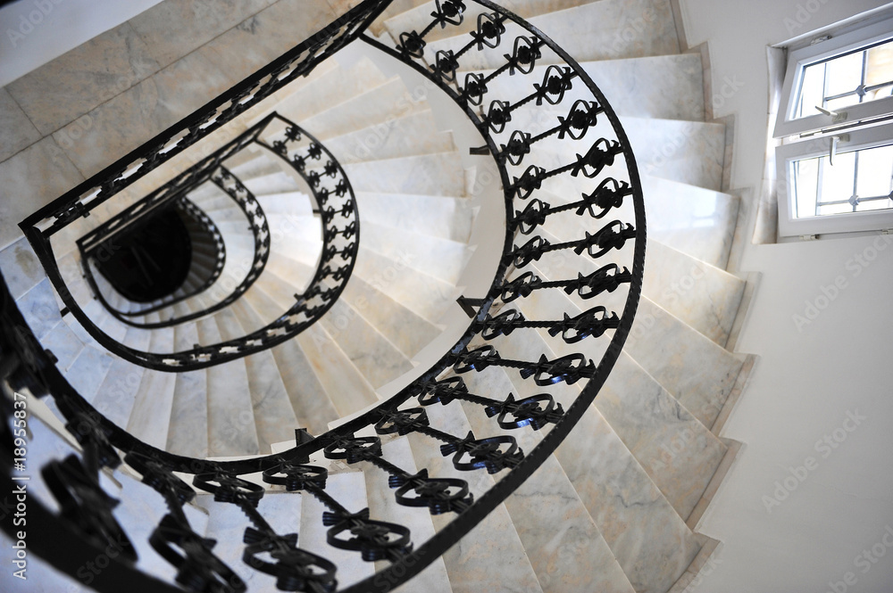 Fototapeta premium winding stairs with the forged rails