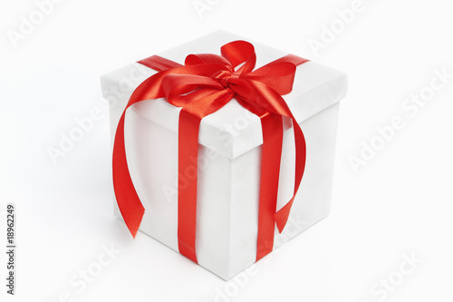 White Christmas present with red ribbon