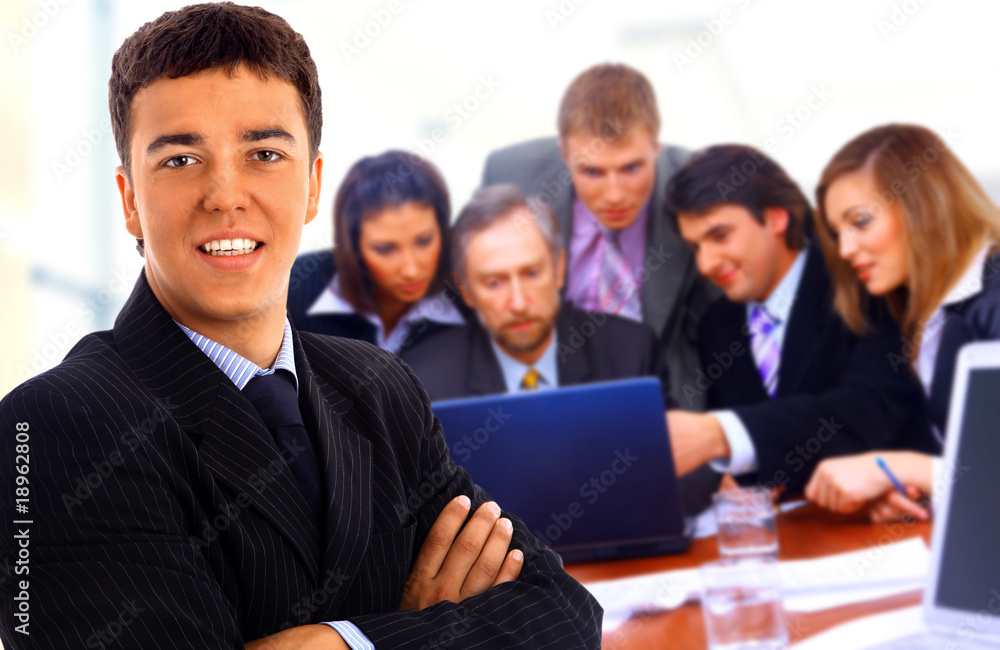 Happy business people seated in a row. Happy business people seated in a row.