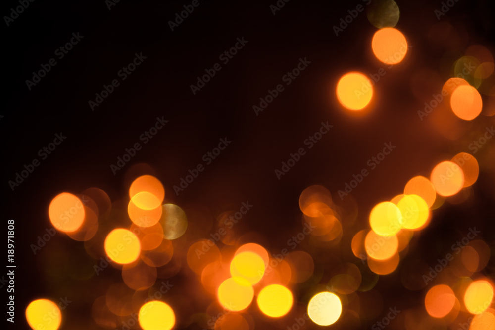 Gold lights defocused on a dark background