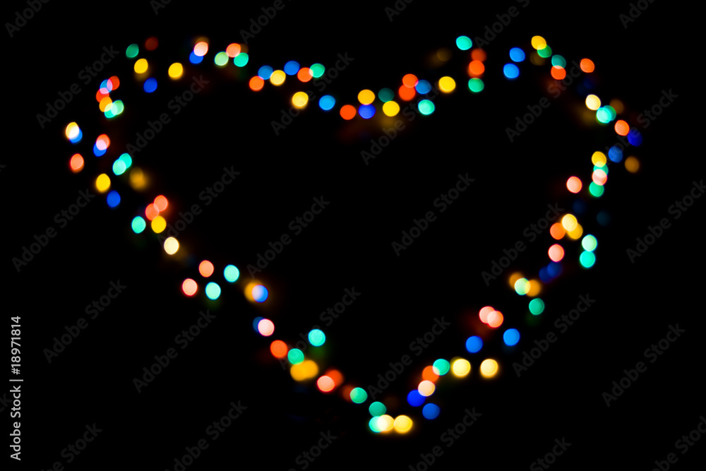 A heart made of colorful lights on black A heart made of colorful lights on black
