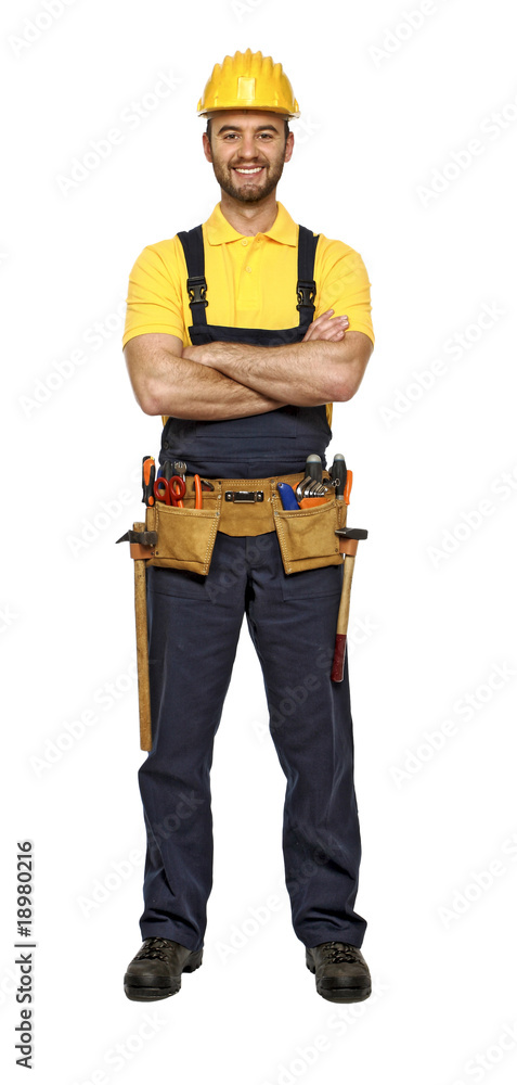 classic pose of young caucasian confident handyman classic pose of young caucasian confident handyman