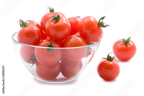 ripe tomatoes in glass bowl isolated