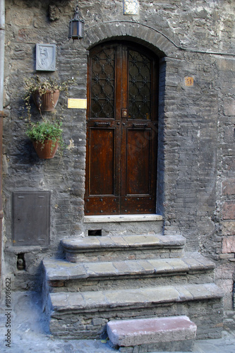 Wooden door with a stone door frame photo