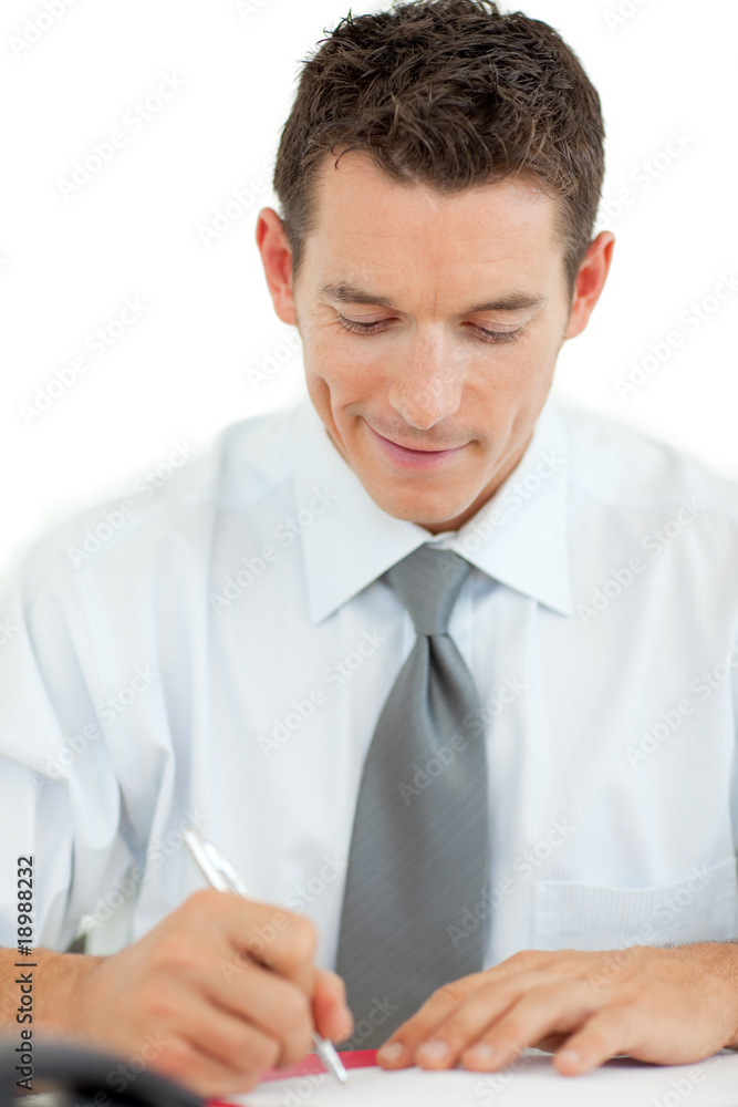 Portrait of a smiling businessman writing Portrait of a smiling businessman writing