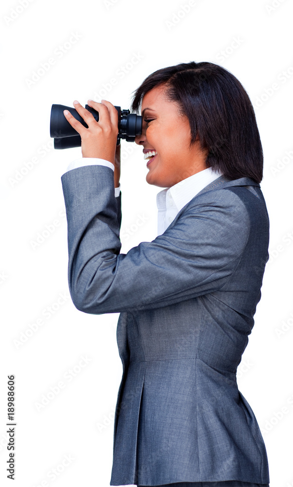 Smiling businesswoman looking through binoculars Smiling businesswoman looking through binoculars