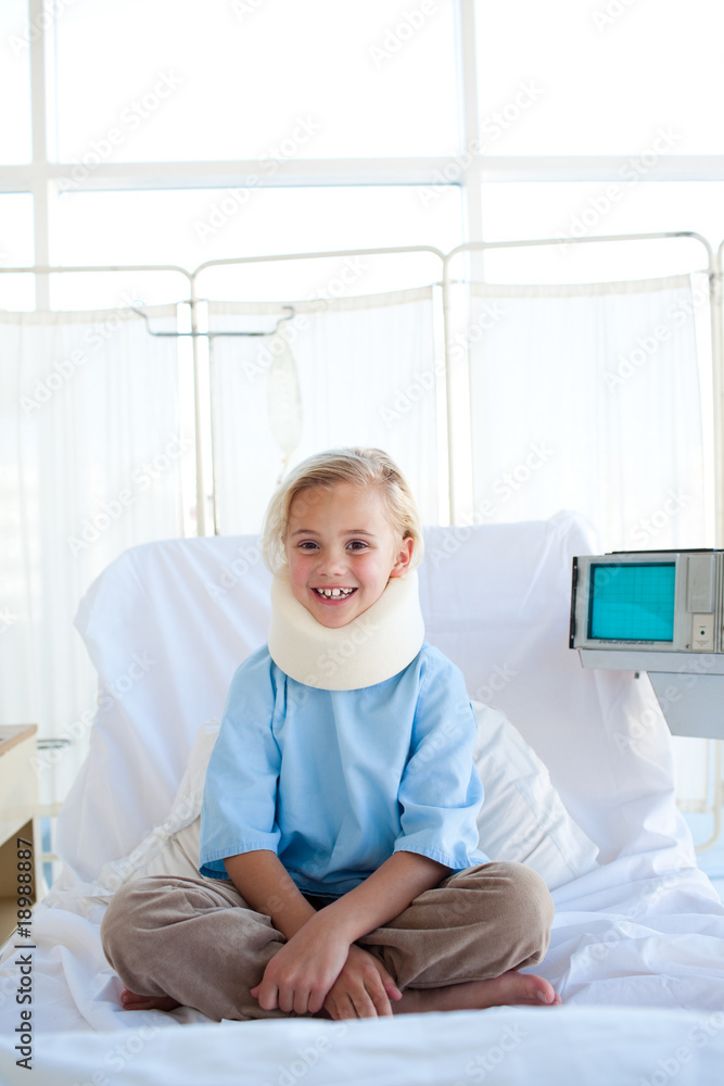Smiling girl sitting on a hospital bed Smiling girl sitting on a hospital bed