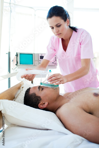 Male patient receiving oxygen mask