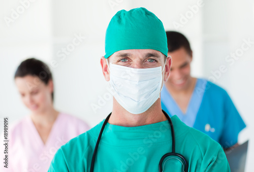 Portrait of a surgeon wearing a surgical mask photo