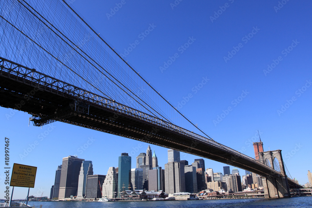 Brooklyn Bridge and Manhattan skyline on a Clear Blue day Brooklyn Bridge and Manhattan skyline on a Clear Blue day
