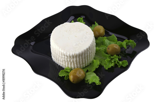 soft feta cheese on black dish